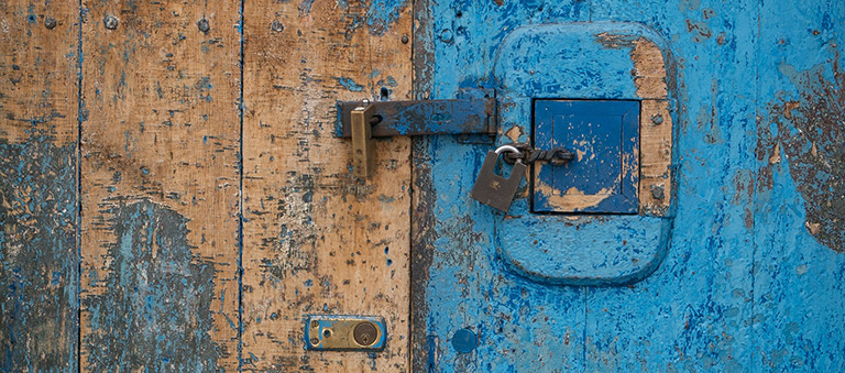 Painted wooden door with locks